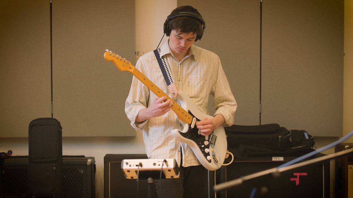 Sam Thompson playing guitar